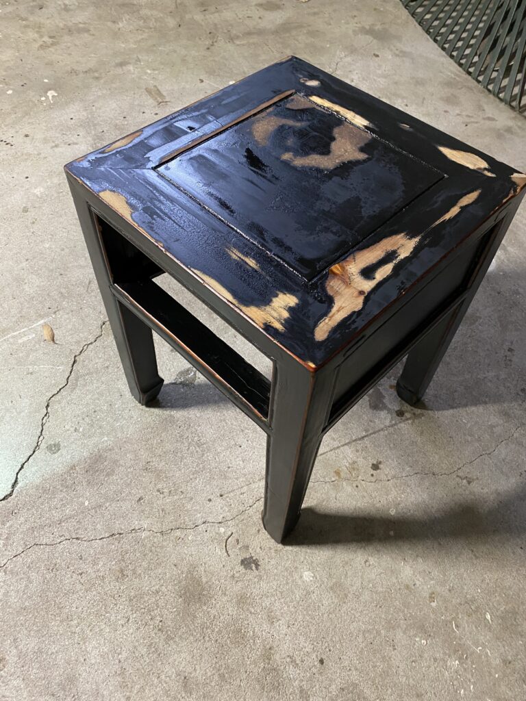 old side table scraping black paint