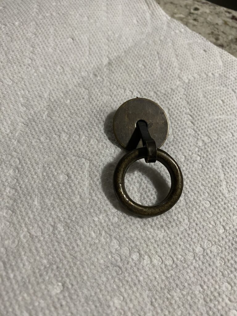 old drawer pull before cleaning